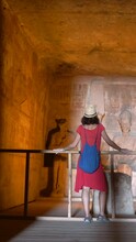 A Young Woman Visiting The Inner Rooms Inside The Temple Of Abu Simbel, In Southern Egypt In Nubia Next To Lake Nasser. Temple Of Pharaoh Ramss II, 4k Video