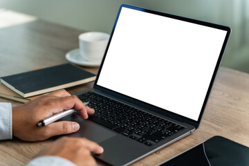 Wall Mural - male hands and a laptop with a blank screen in a cafe mock up blank-screen computer desktop