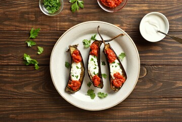 Wall Mural - Roasted aubergine with yogurt and tomato sauce dressing