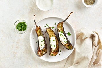 Wall Mural - Oven roasted aubergine with garlic yogurt dressing