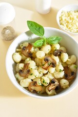 Wall Mural - Potato gnocchi with mushroom, parmesan cheese and greens