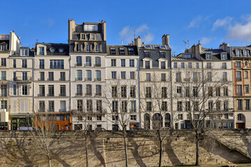 typical parisians building facade , haussmannian style  , Seine river embankments