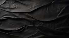 Black Crumpled Paper Texture In Low Light Background