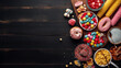 © TrendyImages - Carnival theme food table scene over a dark wood banner background. Top down view. Summer fair concept. Corn dogs, funnel cake, cotton candy and snacks, Ai generated image