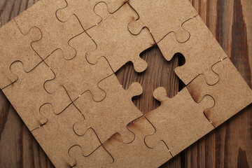 Wall Mural - Wooden pieces jigsaw puzzle on wooden table