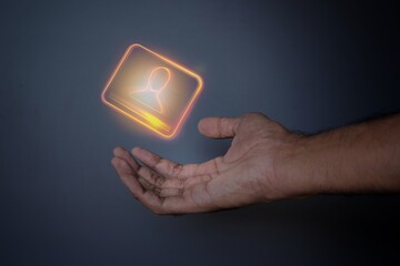 Closeup image of hand and digital identification card or digital ID on black background. Technology concept.