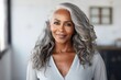 Beautiful African American senior woman with smooth healthy face skin and grey hair