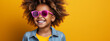 Portrait, studio and happy child pointing hand at space with a smile on face on yellow background. Young girl kid with happiness, carefree and positive attitude to show product placement mockup deal