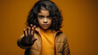 Portrait of kid doing stop sing with palm of hand. Warning expression with negative and serious gesture on face. People emotion lifestyle concept