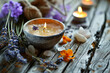 Spa products, soaps, salts and lit candle with lavender flowers