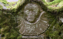A Moss Covered Tombstone In Luss The Scottish Highlands