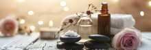 Beauty Treatment Items For Spa Procedures On White Wooden Table. Massage Stones, Essential Oils And Sea Salt. Copy Space