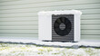 Photorealistic 3d render of a fictitious air source heat pump mounted to a concrete base with vibration dampers on the outside of a house in winter with snow cover.