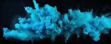 Explosion Of Turquoise Blue Colored Powder On Black Background