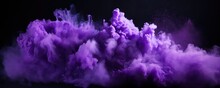 Explosion Of Lilac Colored Powder On Black Background
