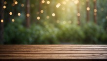 A Background With An Empty Brown Wooden Table And Blurred Trees And Bushes. Spring Or Summer Wallpaper With An Empty Space. Natural Bokeh. Rays Of Light. Daylight.