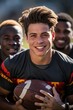 © tirlik - Close photo portrait of a guy with a sweet smile with a soccer ball. young men go in for sports. The United children's sports team is ready to play. Children's team sport. Youth sports for children.