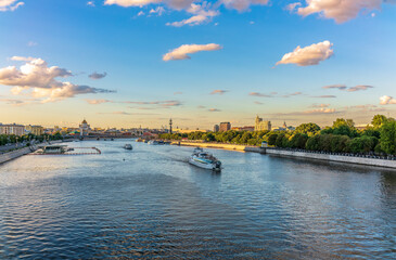 Cruise ship sails on the Moscow river in Moscow city center, popular place for walking.