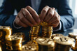 Close up of a man dressed in suit holding golden bitcoins. Future currency, stock exchange, trading. High quality photo