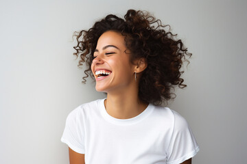 Wall Mural - Young happy positive brunette woman smiling broadly eyes closed on light background. Generative AI.