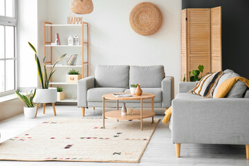Wall Mural - Interior of light living room with grey sofas and wooden coffee table