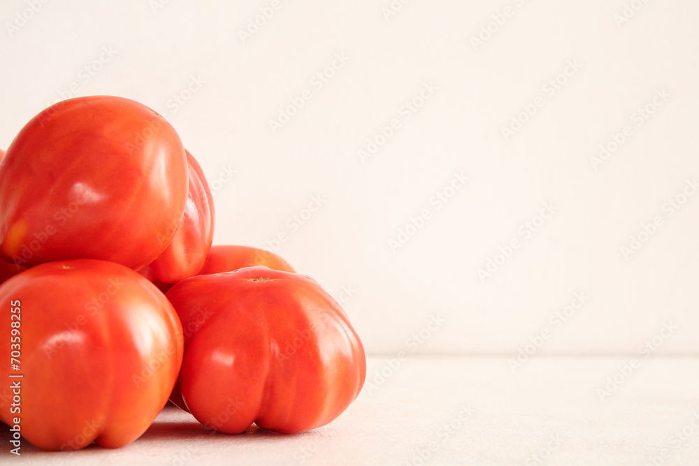 Heap of fresh ripe tomatoes on white background