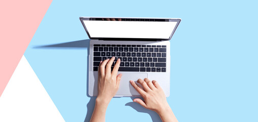 person using a laptop computer from above