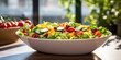 Crisp salad with assorted vegetables in a white square bowl