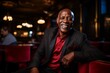 © Nerea - Portrait of a happy senior african american man in a restaurant.