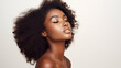 Beautiful young black woman with glowing healthy skin close-up. Advertising of cosmetics, perfumes, copy space