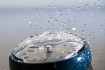 Clock and splashing water drops.