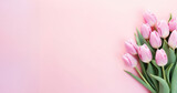 Fototapeta Tulipany - Delicate Pink Tulips on Soft Pastel Background - A fresh bouquet of spring tulips gracefully arranged at the corner, symbolizing gentle elegance