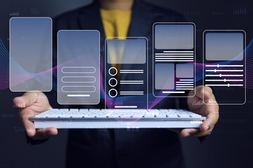 Mobile app user interface design software graphic development concept with graphic designer holding keyboard to UX, UI prototype design and test application in various form to support user requirement