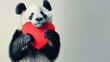  a panda bear holding a red heart in it's paws and looking at the camera with a serious look on his face.