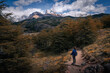 © Puwaphat - A woman with blue cloth looking at to the Mt.Fitz roy with beautiful clouds and sky  (Patagonia, El chalten, Argentina)