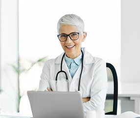 Wall Mural - doctor senior laptop woman medical hospital care health clinic elderly mature caucasian female happy healthcare glasses office confident medicine occupation