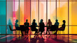 © Trendy Graphics - Silhouettes of several people in a meeting room along with a colorful window behind them