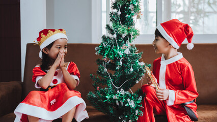 Portrait of happy girl decorating Christmas tree
