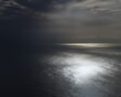 clouds and sunstreak over the sea