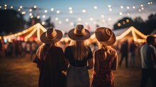 Women In Country Clothes On Music Festival. Blurred Background With Bulb Lights