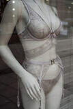 Fototapeta Sypialnia - Closeup of grey underwear on mannequin in a fashion store showroom