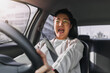 © Suthida - Asian Thai woman driving on road, screaming shocking of car accident crashing.
