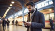 © JorgeHumberto - Stylish Man Checking Phone Messages at Busy Train Station