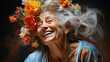Portrait of a beautiful old woman with a wreath of flowers on her head. A happy senior woman.