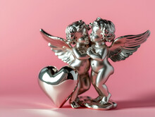 Two Metallic Silver Cupids In Love With A Heart On A Pink Background