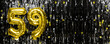 Gold foil balloon number number 59 on a background of black tinsel decoration. Birthday card, inscription fifty-nine. Anniversary event. Banner.