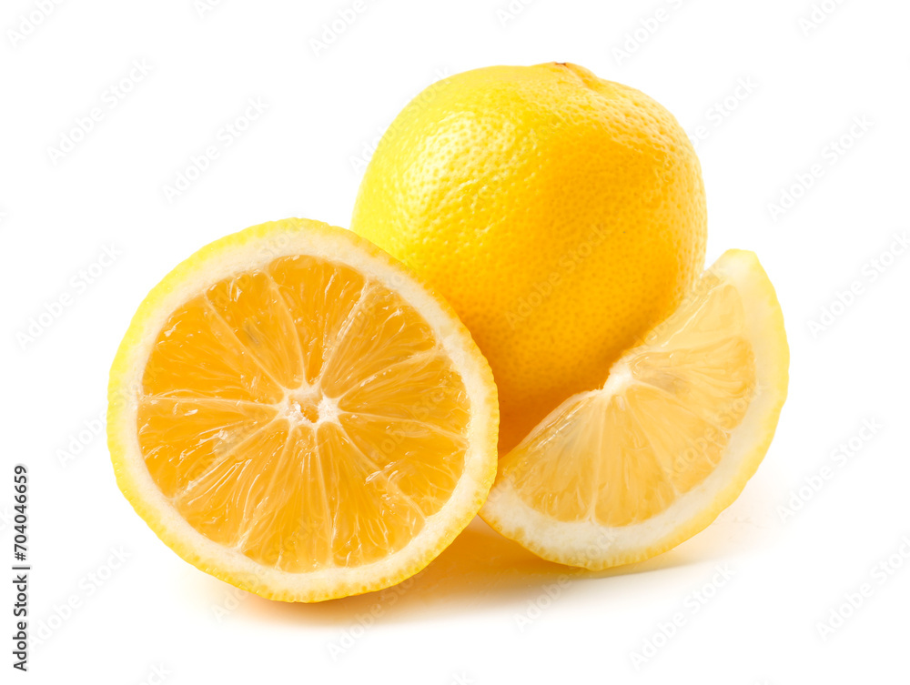 Whole and cut fresh lemons on white background
