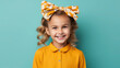 beautiful smiling little girl with headband and wavy hair on color background in studio, happy child, children's fashion, portrait, kid, childhood, stylish person, cute baby, hairband, emotional face