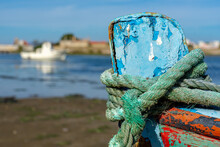 Part Of The Bow Of The Wooden Bow Of The Fishing Boat With Green Rope, Blurred Background