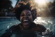 african american woman swiming in the pool at summer, happy black person having fun on vacation laughing and splashing cheerfully coming out of the water